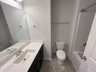 84 Aspen Road, Hampstead, NC 28443 — 3-bedroom townhome in Cypress Grove, Hampstead, NC, photo 22 of 28: Hallway bathroom