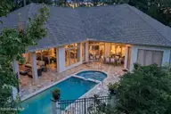 8900 Mahogany Run, Wilmington, NC 28411 — 3-bedroom home in Porters Neck Plantation, Wilmington, NC, photo 1 of 75: 1-web-or-mls-07_T07_aerial-pool-spa-and-