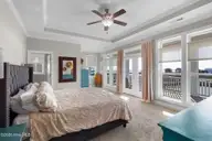 525 Sanders Lane, Newport, NC 28570 — 4-bedroom waterfront home in Bogue Watch, Newport, NC, photo 23 of 57: Primary suite with creek views