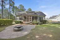104 Bargate Drive, New Bern, NC 28562 — 3-bedroom home in Hunters Ridge, New Bern, NC, photo 8 of 62: Stamped Concrete Patio with Firepit