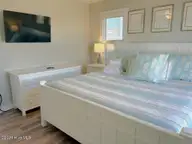 209 W Beach Drive, Oak Island, NC 28465 — 5-bedroom waterfront home in W. Long Beach, Oak Island, NC, photo 24 of 60: 209 W Beach Drive 29