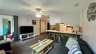 9201 Coast Guard Road E-101, Emerald Isle, NC 28594 — 3-bedroom waterfront condo in Pebble Beach, Emerald Isle, NC, photo 23 of 50: den to dining