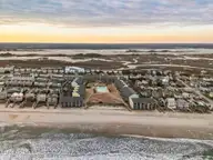 918 N New River Drive 322, Surf City, NC 28445 — 1-bedroom condo in Surf Condominiums, Surf City, NC, photo 10 of 38: DJI_20250220173518_0679_D