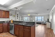 1505 Salter Path Road 304, Indian Beach, NC 28512 — 2-bedroom waterfront condo in Summer Winds Condominiums, Indian Beach, NC, photo 14 of 53: Kitchen & Living Area
