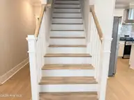 112 Flat Clam Drive, Wilmington, NC 28401 — 3-bedroom home in Riverside Cove, Wilmington, NC, photo 3 of 23: Hardwood Treads
