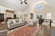 609 Neuse Harbour Boulevard, New Bern, NC 28560 — 4-bedroom waterfront home in Neuse Harbour, New Bern, NC, photo 9 of 57: Living open to dining