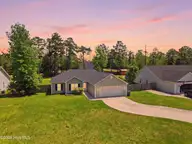 104 Van Riggs Road, Hubert, NC 28539 — 3-bedroom home in Woods Edge, Hubert, NC, photo 1 of 35: DJI_0331_twilight_2859df0e