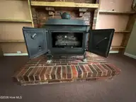 118 Oakwood Drive, Havelock, NC 28532 — 4-bedroom home, Havelock, NC, photo 22 of 56: Family room Stove