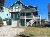 144 Tuna Drive, Holden Beach, NC 28462 — 3-bedroom waterfront home in Harbor Acres, Holden Beach, NC, photo 1 of 58: 144 Tuna Front