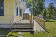 2912 Newport Circle, Newport, NC 28570 — 3-bedroom home in Village Heights, Newport, NC, photo 12 of 22: Walkway to Side Entrance