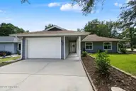 690 Fairway Drive E, Sunset Beach, NC 28468 — 4-bedroom home in Sea Trail Plantation, Sunset Beach, NC, photo 2 of 61: Home Front