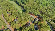 14 Rathlin Court, Pinehurst, NC 28374 — 4-bedroom home in Pinewild CC, Pinehurst, NC, photo 2 of 53: 62-dji_fly_20260714_173234_0162_17841723