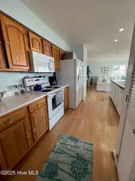 801 Ocean Drive, Emerald Isle, NC 28594 — 4-bedroom waterfront home, Emerald Isle, NC, photo 14 of 32: 14 Kitchen with laundry closet and a