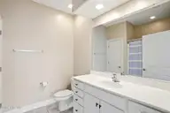 613 Elfin Court, Leland, NC 28479 — 2-bedroom townhome in Westport, Leland, NC, photo 18 of 28: Primary Bath