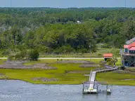 210 42 Waterway Drive, Sneads Ferry, NC 28460 — waterfront lot in Golden Acres, Sneads Ferry, NC, photo 22 of 23: 208 and 210 Waterway Drive - Aerials - E