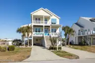 127 Sound Point Drive, Harkers Island, NC 28531 — 4-bedroom home in Cape Point Village, Harkers Island, NC, photo 2 of 56: Dual Concrete Parking