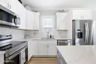 135 NE 75th Street, Oak Island, NC 28465 — 4-bedroom home in Tranquil Harbor, Oak Island, NC, photo 8 of 37: Kitchen