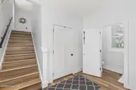 2108 Hidden Harbor Drive, New Bern, NC 28562 — 4-bedroom home in Hidden Harbor, New Bern, NC, photo 23 of 51: stairs to FROG/powder room