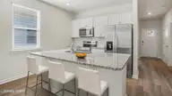 3084 Tasso Drive SW, Sunset Beach, NC 28468 — 3-bedroom home in Southshore Bay, Sunset Beach, NC, photo 3 of 18: 010_dsc06821_-_kitchen_232