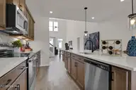 1218 Sunwater Terrace, Leland, NC 28451 — 4-bedroom townhome in Grand Park, Leland, NC, photo 13 of 49: Kitchen 3 - Hyacinth BE - Grand Park