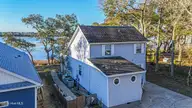 2509 Gator Lane SW, Supply, NC 28462 — 3-bedroom waterfront home in Gators Grant, Supply, NC, photo 1 of 56: DJI_20260319084012_0096_D