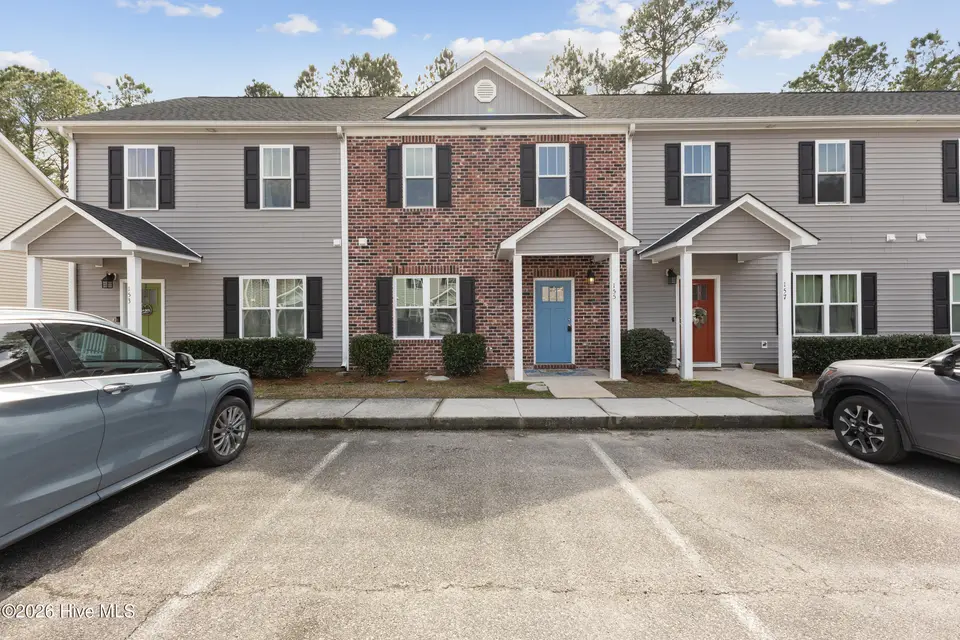 155 Lincoln Place Circle, Leland, NC 28451 — 3-bedroom townhome in Lincoln Place Townhomes, Leland, NC, photo 1 of 39: 155 Lincoln Place CIrcle - Brick front