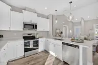 9579 Lily Pond Court NE, Leland, NC 28451 — 3-bedroom home in Lily Pond, Leland, NC, photo 15 of 33: Open floor plan
