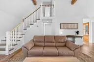 501 Shoreline Drive E, Sunset Beach, NC 28468 — 3-bedroom waterfront home in Shoreline Woods, Sunset Beach, NC, photo 12 of 39: Bright tall ceilings and beams