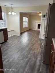 102 Dockside Drive, Jacksonville, NC 28546 — 4-bedroom waterfront home in Hunters Creek, Jacksonville, NC, photo 5 of 33: Kitchen to Living Room