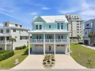 109 Ocean Bluff Drive, Indian Beach, NC 28512 — 6-bedroom waterfront home in Ocean Bluff, Indian Beach, NC, photo 1 of 57: Front Elevation