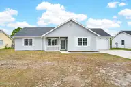 411 Foxtrace Lane, Hubert, NC 28539 — 3-bedroom home in Foxtrace, Hubert, NC, photo 1 of 28: Front of home