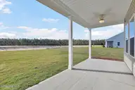 483 Galloping Foal Way SE, Bolivia, NC 28422 — 3-bedroom home in River Tide Farms, Bolivia, NC, photo 24 of 25: Covered Patio