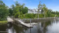 615 Jenoa Drive, Castle Hayne, NC 28429 — 4-bedroom townhome in River Bluffs, Castle Hayne, NC, photo 3 of 50: DJI_20260807145037_0132_D