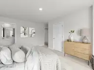 7034 Dunford Road Unit 119, Leland, NC 28451 — 3-bedroom townhome in SeaBrooke, Leland, NC, photo 14 of 30: Primary Bedroom