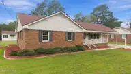 1120 Par Three Drive S, Wilson, NC 27893 — 3-bedroom home in Willow Springs, Wilson, NC, photo 2 of 50: Front 2
