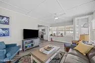 5127 W Beach Drive, Oak Island, NC 28465 — 5-bedroom waterfront home, Oak Island, NC, photo 19 of 73: 40_sun room