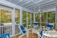 23 Ibis Roost, Bald Head Island, NC 28461 — 3-bedroom home in Ibis Roost, Bald Head Island, NC, photo 21 of 40: Screened in Porch
