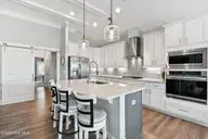 1353 Dunes Boulevard SW, Ocean Isle Beach, NC 28469 — 3-bedroom waterfront home in Retreat At OIB, Ocean Isle Beach, NC, photo 13 of 44: Upgraded prestige kitchen!