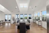 585 Forest Dunes Drive, Pine Knoll Shores, NC 28512 — 4-bedroom waterfront home in Beacon's Reach, Pine Knoll Shores, NC, photo 21 of 68: Elegant oceanside dining