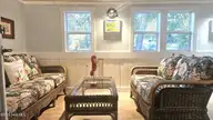 2495 Barracuda Street SW, Supply, NC 28462 — 2-bedroom manufactured home in Sandy Shoals, Supply, NC, photo 8 of 54: New Windows, Enclosed Front Porch