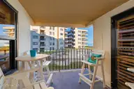 1505 Salter Path Road 235 Summer Winds, Indian Beach, NC 28512 — 3-bedroom waterfront condo in Summer Winds Condominiums, Indian Beach, NC, photo 12 of 46: Covered porch off dining room
