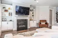 357 Wheatfield Way, Whispering Pines, NC 28327 — 5-bedroom home in Summerfield at Arrowstone, Whispering Pines, NC, photo 16 of 44: Living Room with Gas Fireplace