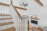 501 Shoreline Drive E, Sunset Beach, NC 28468 — 3-bedroom waterfront home in Shoreline Woods, Sunset Beach, NC, photo 22 of 39: Stairs to bedroom and bathroom upstairs