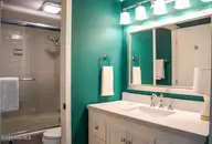 800 Saint Andrews Drive # 232, Pinehurst, NC 28374 — 2-bedroom condo in Linville Garden, Pinehurst, NC, photo 15 of 21: Loblolly Primary Bathroom x2