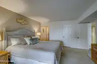 10300 Coast Guard Road E103, Emerald Isle, NC 28594 — 3-bedroom waterfront condo in Point Emerald Villas, Emerald Isle, NC, photo 17 of 47: Master BR with walkin closet