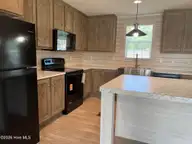 316 Commodore Drive, Rocky Mount, NC 27801 — 3-bedroom manufactured home in Eastfield, Rocky Mount, NC, photo 4 of 32: Kitchen view 3