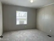 316 Commodore Drive, Rocky Mount, NC 27801 — 3-bedroom manufactured home in Eastfield, Rocky Mount, NC, photo 22 of 32: Bedroom #2 view 1