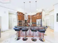 8900 Mahogany Run, Wilmington, NC 28411 — 3-bedroom home in Porters Neck Plantation, Wilmington, NC, photo 14 of 75: 23-web-or-mls-24_STILL072_kitchen-island