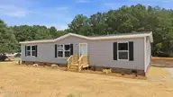 9757 Fire Tower Farm Road, Whitakers, NC 27891 — 3-bedroom manufactured home in Swift Creek Fire Tower, Whitakers, NC, photo 4 of 48: 5-web-or-mls-DJI_20260820132119_0545_D