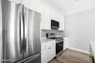 130 NE 75th Street, Oak Island, NC 28465 — 3-bedroom home, Oak Island, NC, photo 10 of 27: shniderproductions.com-40